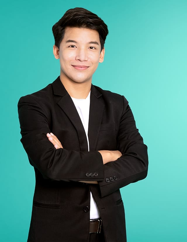 man wearing black blazer smiling